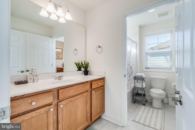 full bathroom with tile patterned floors, vanity, shower / bath combo with shower curtain, a chandelier, and toilet