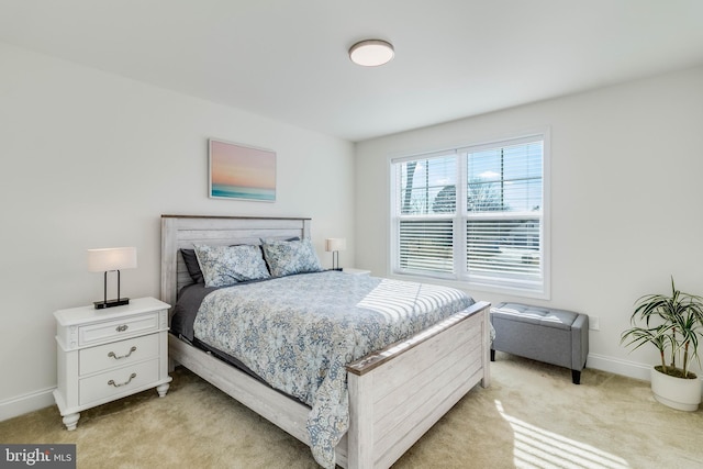 bedroom featuring light carpet