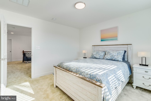 bedroom with light colored carpet