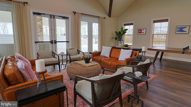 living room featuring french doors, high vaulted ceiling, and dark wood-type flooring