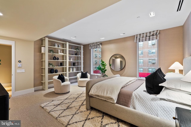 bedroom with light colored carpet