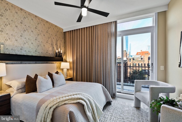 bedroom with ceiling fan, access to exterior, and floor to ceiling windows