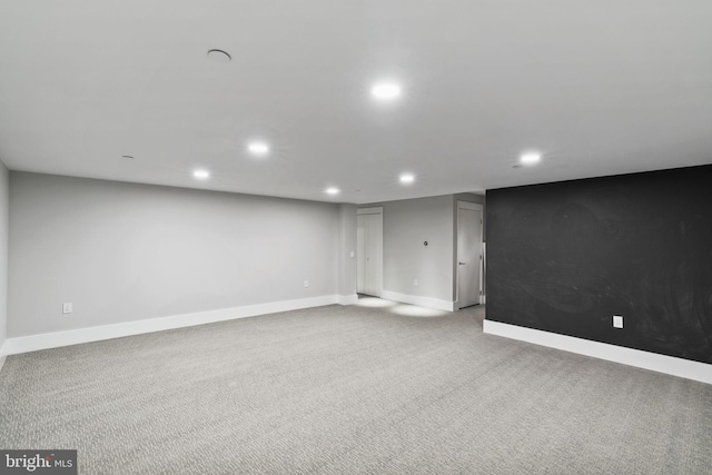 basement with light colored carpet