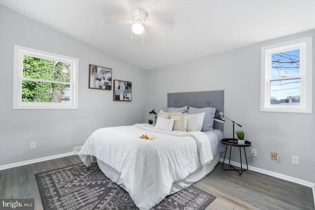 bedroom with hardwood / wood-style floors, ceiling fan, and lofted ceiling