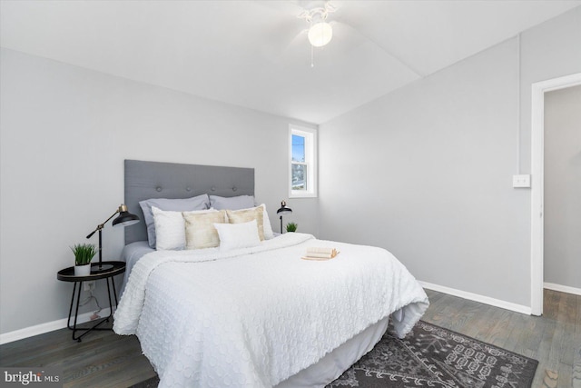 bedroom featuring dark hardwood / wood-style flooring and ceiling fan