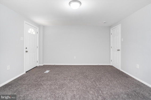 view of carpeted foyer