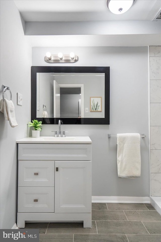 bathroom featuring vanity and walk in shower