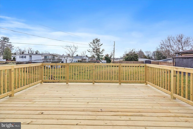 wooden terrace with a yard