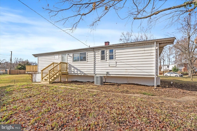 back of property with central AC unit