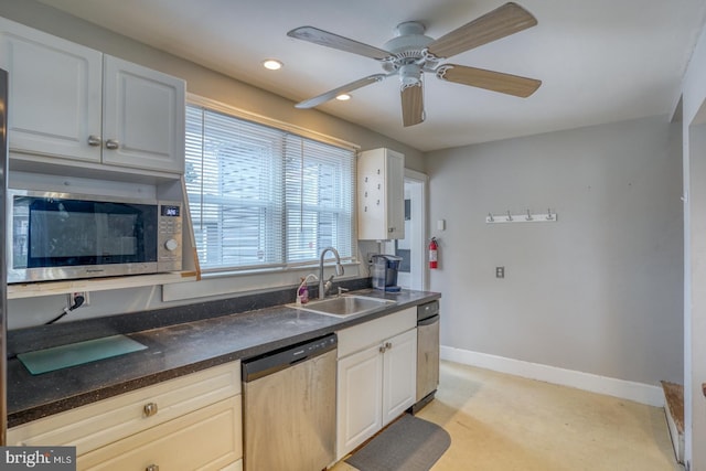 kitchen with white cabinetry, sink, ceiling fan, and stainless steel appliances