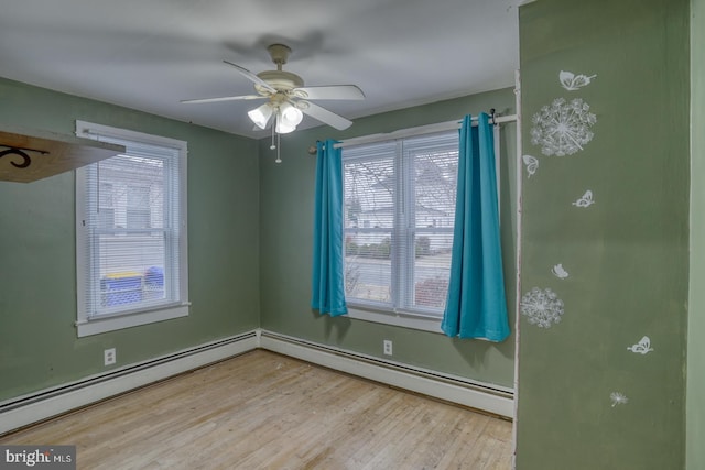 unfurnished room with a baseboard radiator, light hardwood / wood-style flooring, and ceiling fan