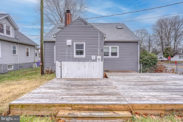 rear view of property with a deck