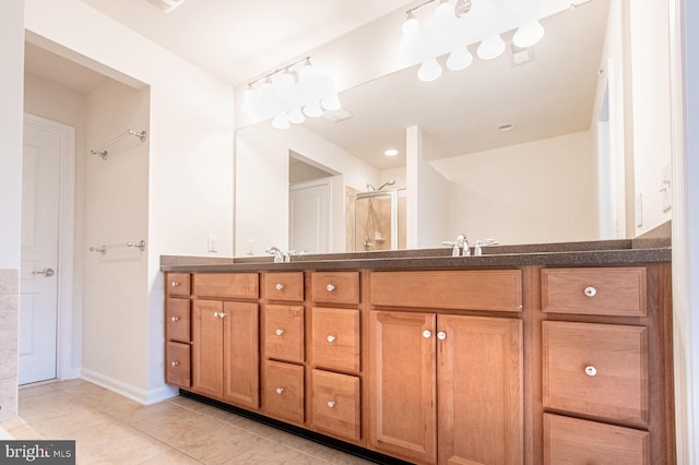 bathroom featuring vanity, tile patterned floors, and an enclosed shower