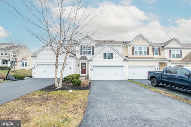 multi unit property featuring a garage