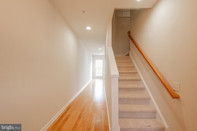 stairway with wood-type flooring