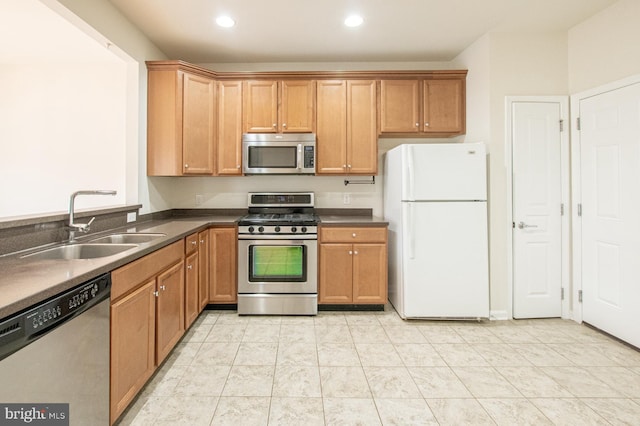 kitchen with sink and appliances with stainless steel finishes