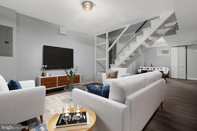 living room featuring electric panel and dark wood-type flooring