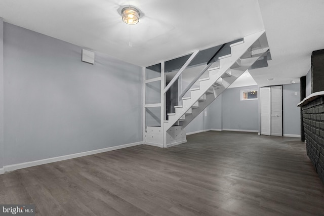 basement featuring dark hardwood / wood-style floors