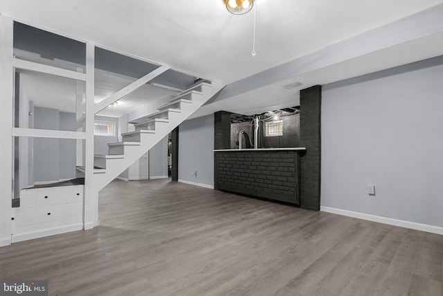 unfurnished living room with hardwood / wood-style floors