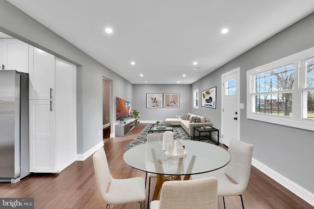 dining area featuring dark hardwood / wood-style flooring