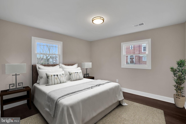 bedroom featuring dark wood-type flooring