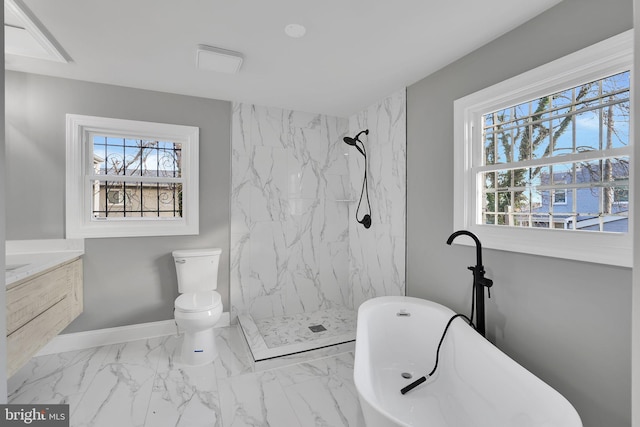 full bathroom with vanity, toilet, a wealth of natural light, and separate shower and tub