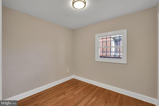 spare room featuring hardwood / wood-style floors