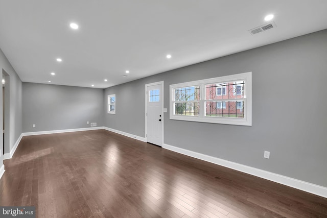 foyer with dark hardwood / wood-style flooring