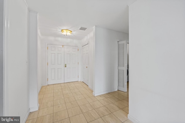 foyer entrance featuring ornamental molding