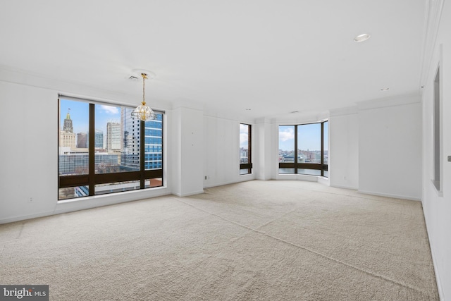 unfurnished living room with carpet floors and ornamental molding