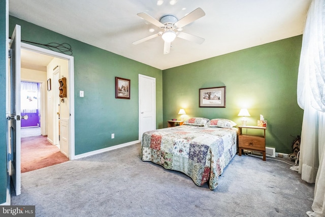 carpeted bedroom featuring ceiling fan