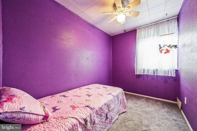 carpeted bedroom with ceiling fan