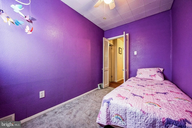 unfurnished bedroom featuring carpet and ceiling fan