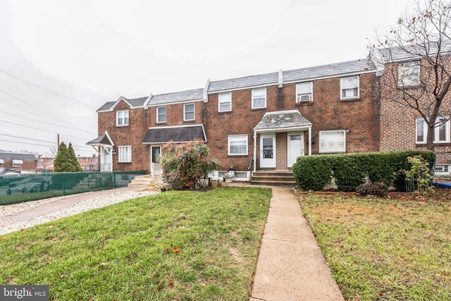 view of property with a front lawn