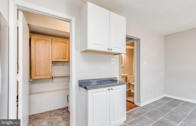 kitchen featuring light brown cabinets