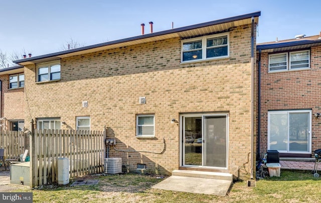 back of house featuring central air condition unit