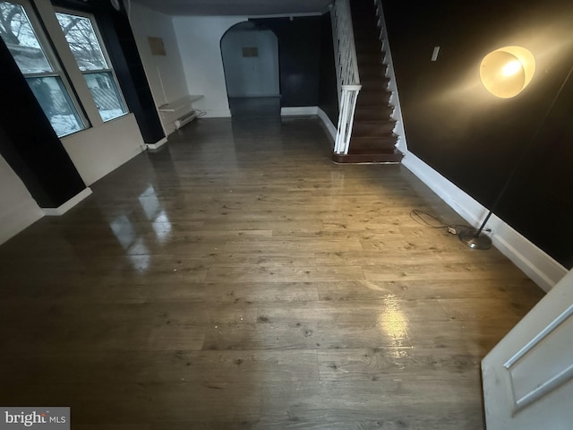 hallway with hardwood / wood-style floors