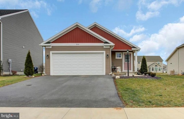 view of front facade featuring a garage and a front lawn