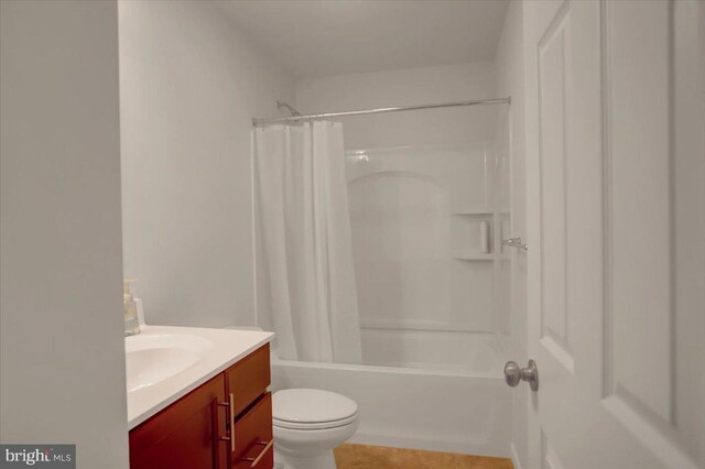 full bathroom featuring vanity, toilet, and shower / bathtub combination with curtain