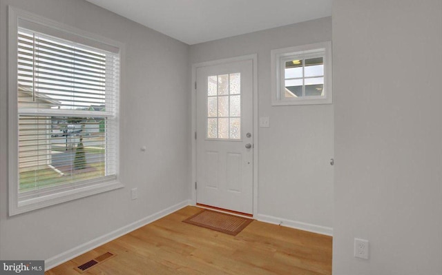 doorway with light hardwood / wood-style floors