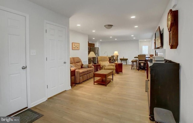 living room with light hardwood / wood-style flooring