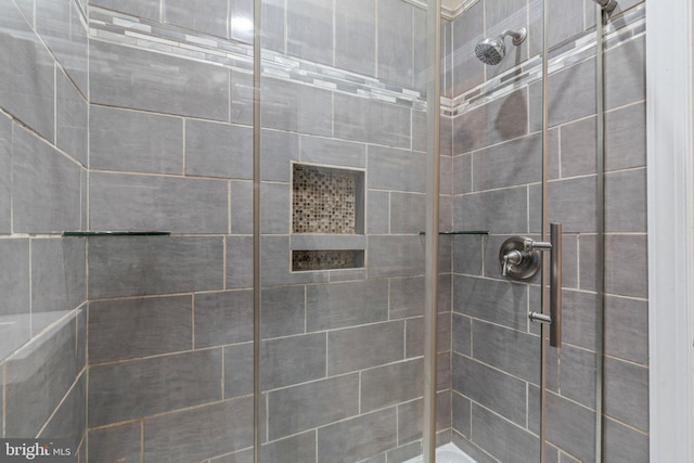 bathroom with tiled shower