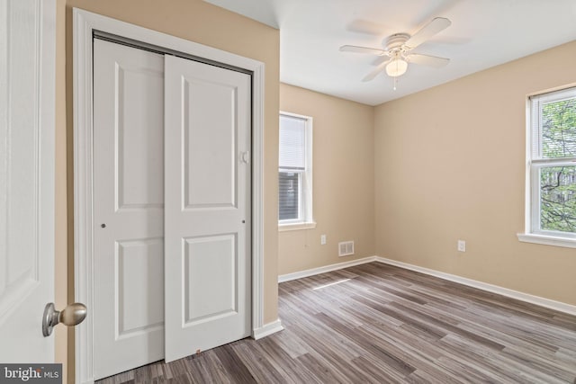 unfurnished bedroom featuring a closet, ceiling fan, and light hardwood / wood-style flooring