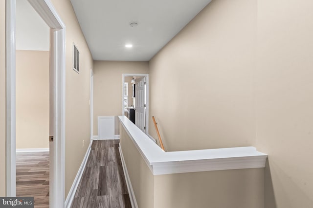 5738 Tulip St, Philadelphia, PA 19135 - corridor featuring dark wood-style floors and recessed lighting