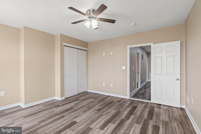 5738 Tulip St, Philadelphia, PA 19135 - unfurnished bedroom with wood finished floors, a closet, and a ceiling fan