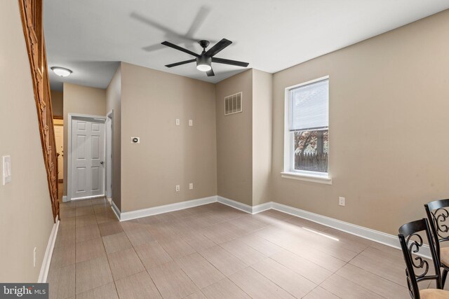 5738 Tulip St, Philadelphia, PA 19135 - empty room with a ceiling fan and baseboards
