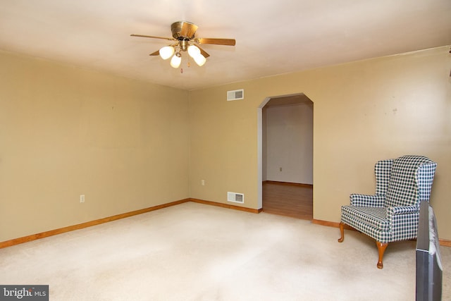 unfurnished room with ceiling fan and carpet floors