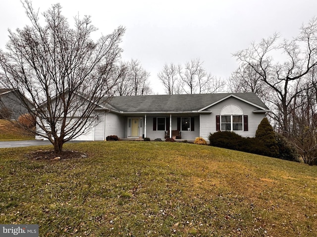 ranch-style house featuring a front lawn