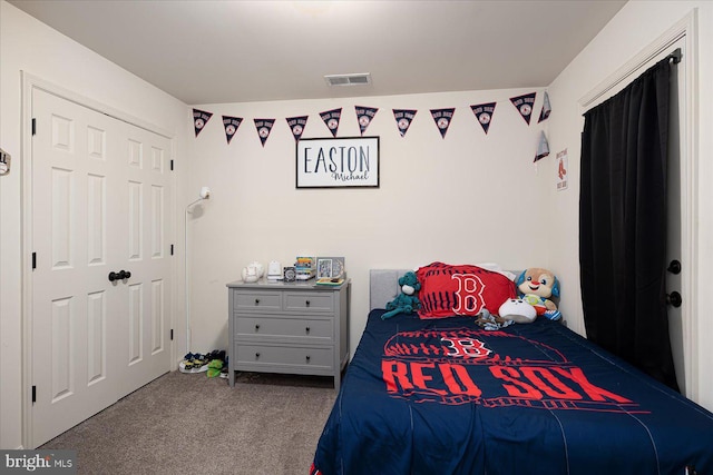 carpeted bedroom featuring a closet