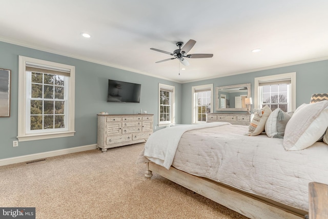 bedroom with ornamental molding, carpet floors, and ceiling fan